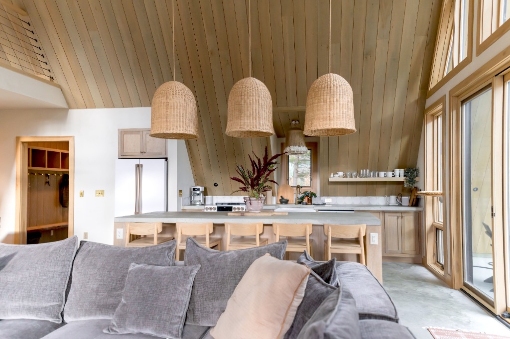 Modern kitchen with woven basket pendants and open shelving